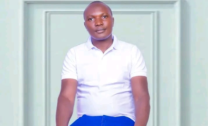 Portrait of Senator Louis Omondi Ochieng Atonga in a white polo shirt