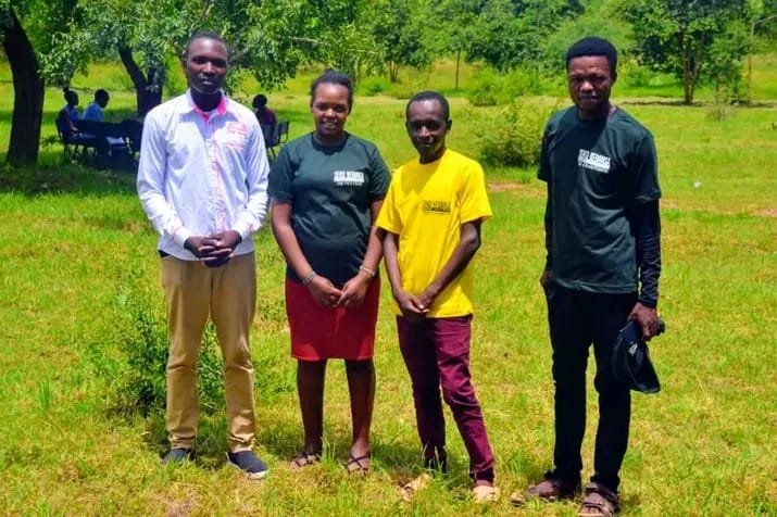 Group of four party leaders outdoors