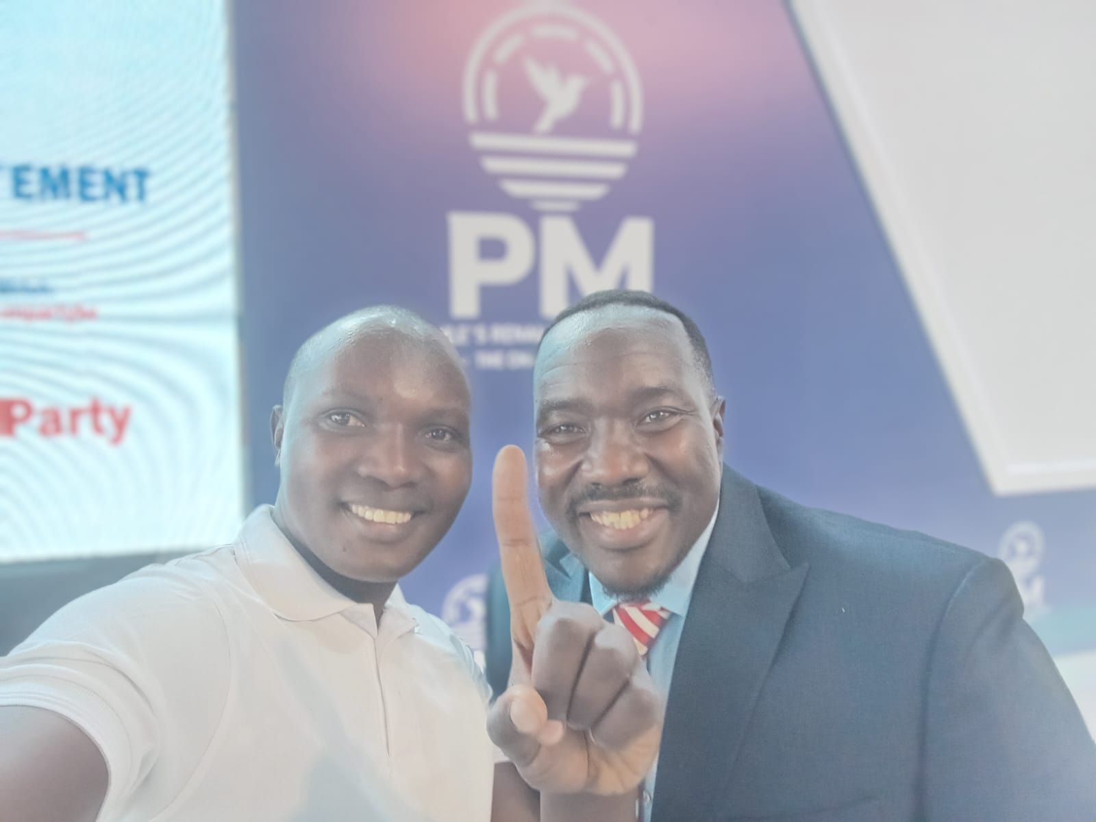 Senator Atonga taking a selfie with comrades at a People's Renaissance Movement (PM Party) event